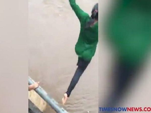 youth jumps in river 